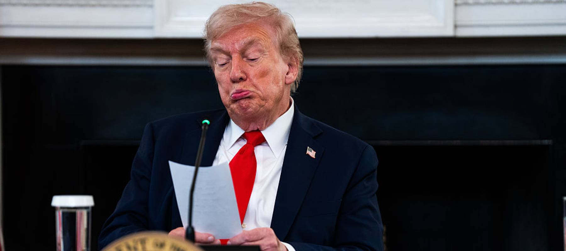 President Trump signs bill with people behind him all giving thumbs up