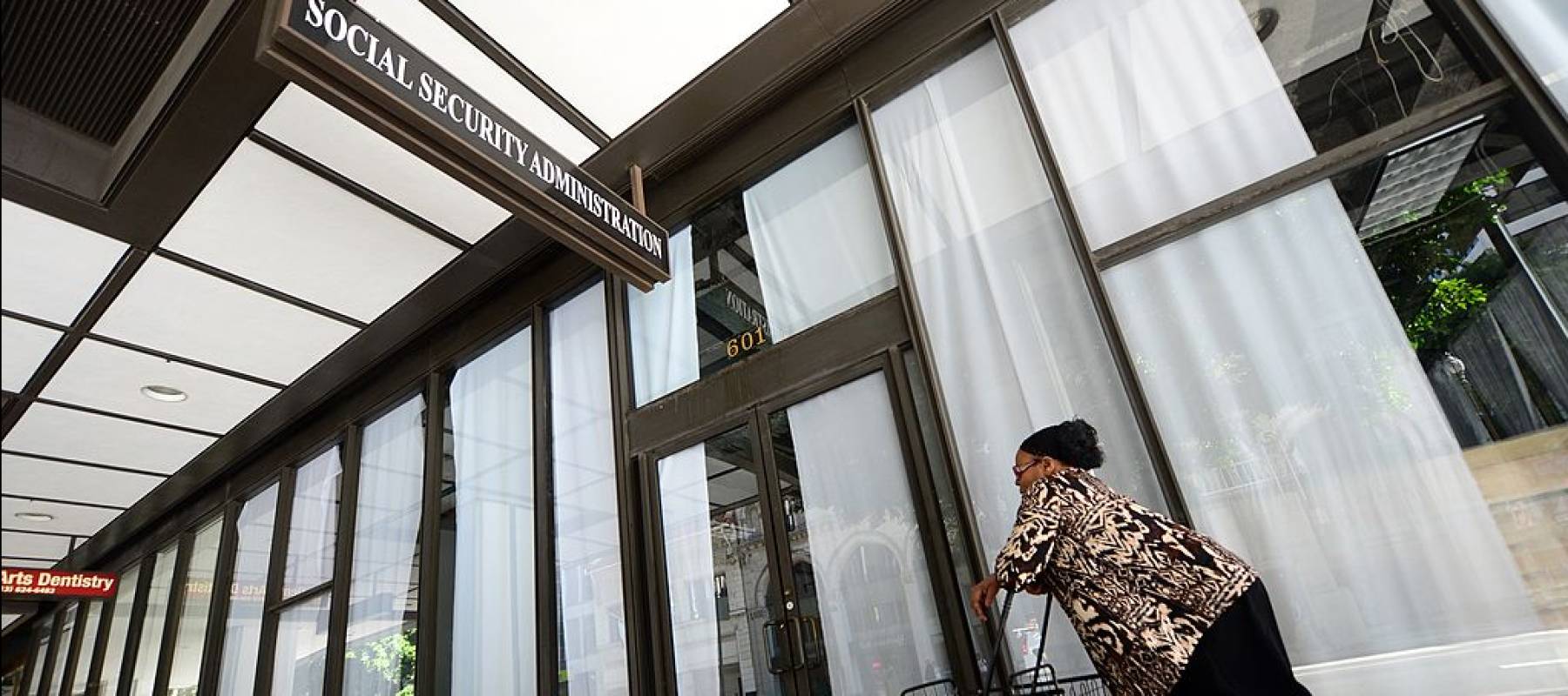 Woman going by Social Security office.