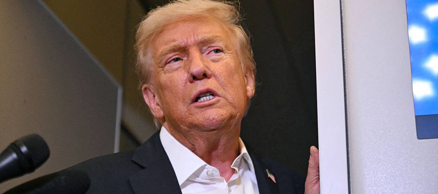 President Donal Trump speaking to reporters on board Air Force One.