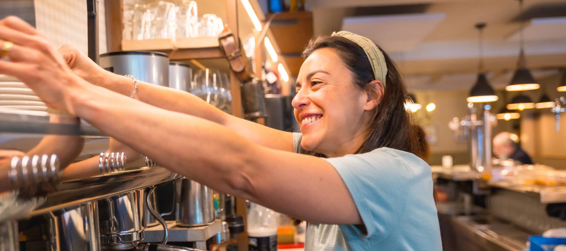 cafeteria preparing coffee in a coffee machine