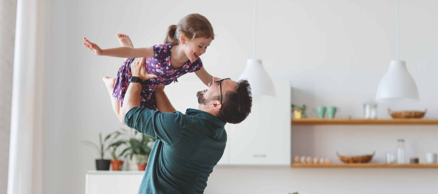 Father's day. Happy family daughter hugs his dad  on holiday