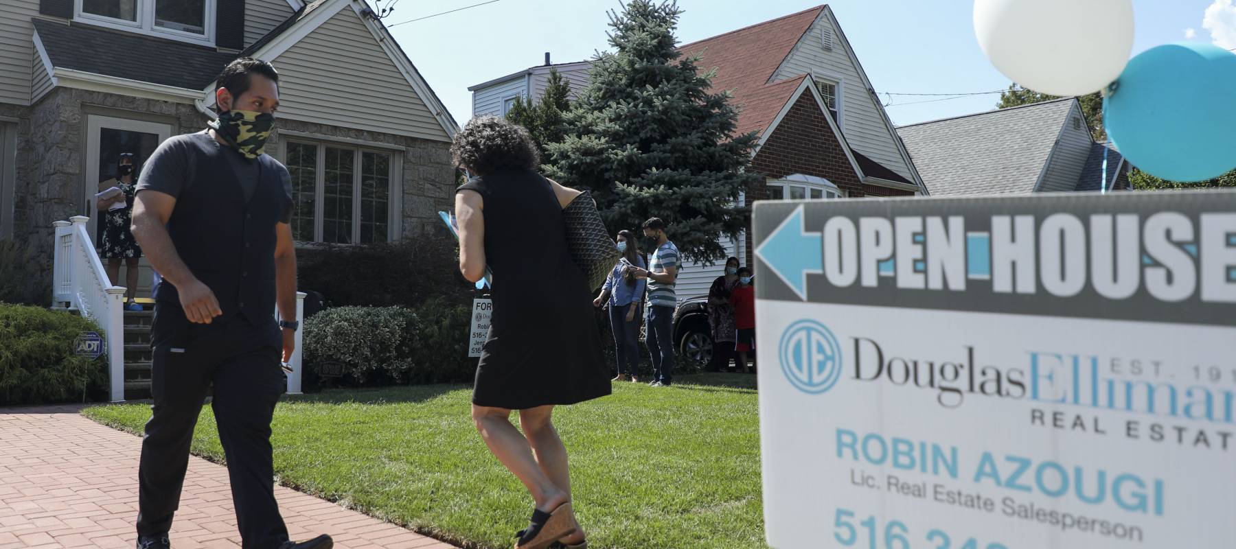 People wait to visit a house for sale in Floral Park, Nassau County, New York, the United States, on Sept. 6, 2020.