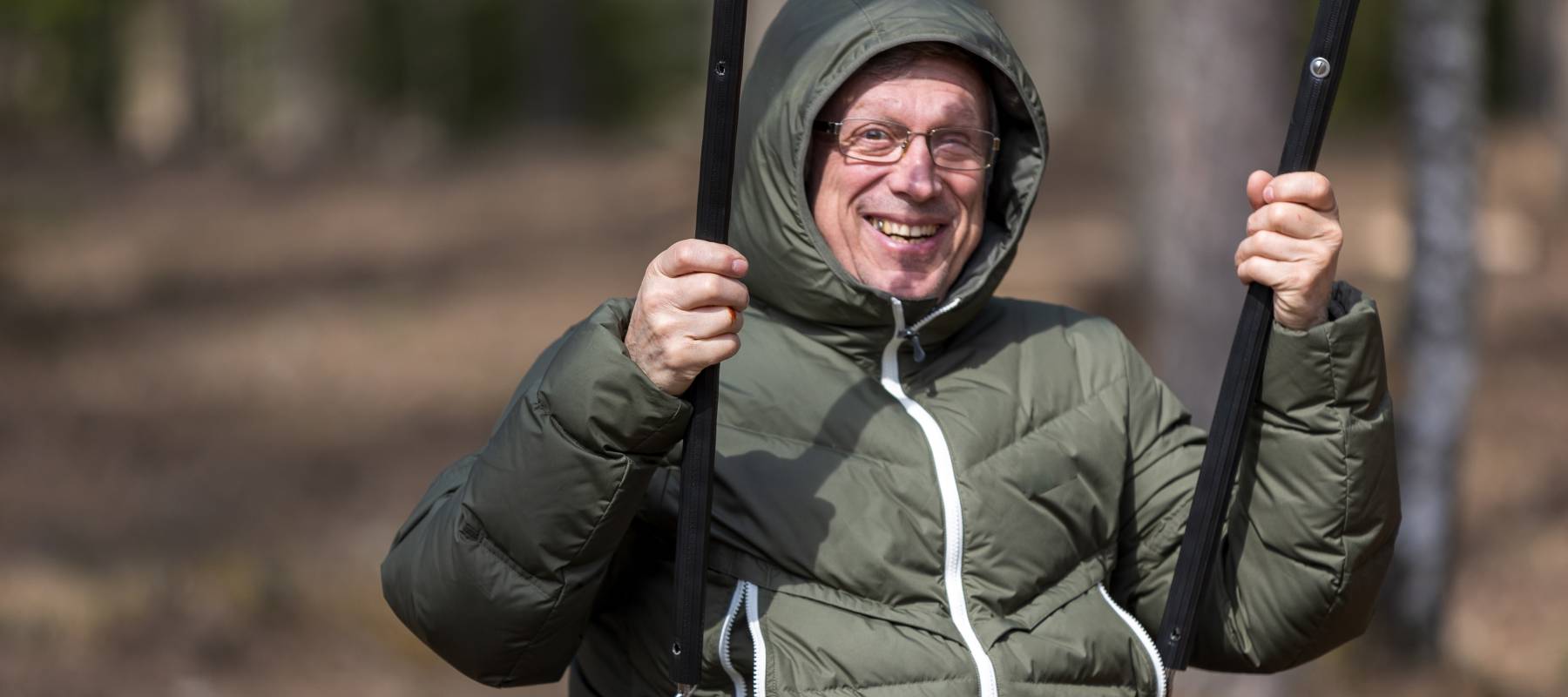 A man swinging at a playground.