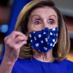 A masked Speaker of the House Nancy Pelosi delivers remarks during a news conference on Oct. 9, 2020.