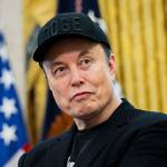 Elon Musk looks on during a news conference with US President Donald Trump in the Oval Office of the White Hous