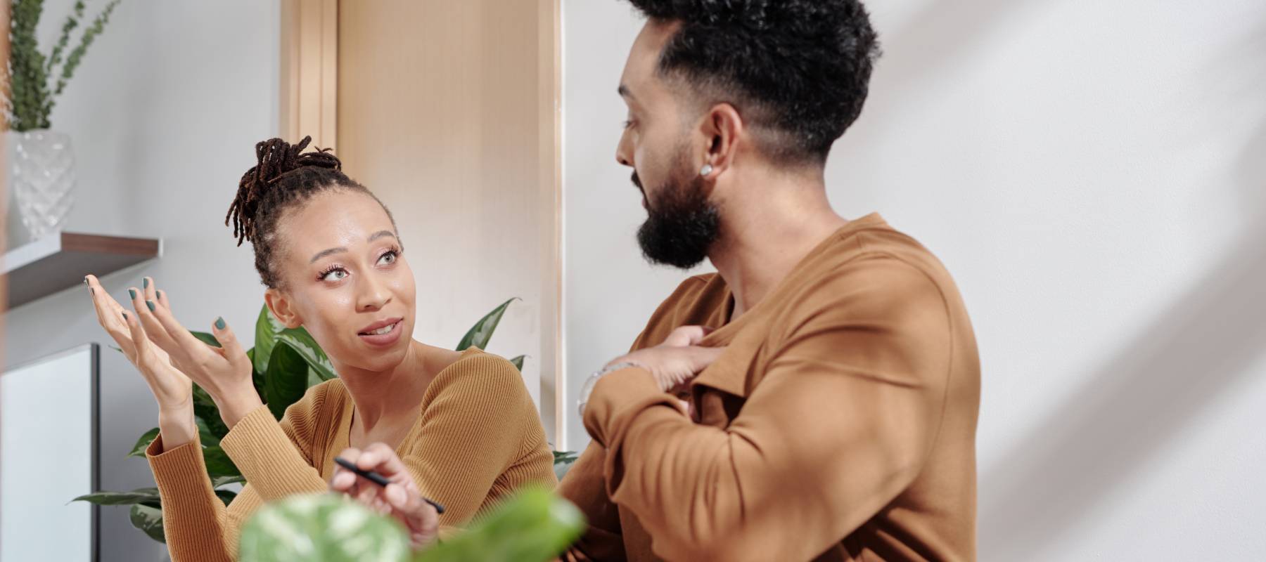 African-American couple discussing something serious at home