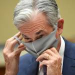 Federal Reserve Chair Jerome H. Powell removes his face mask at a U.S. House hearing on Sept. 23, 2020.