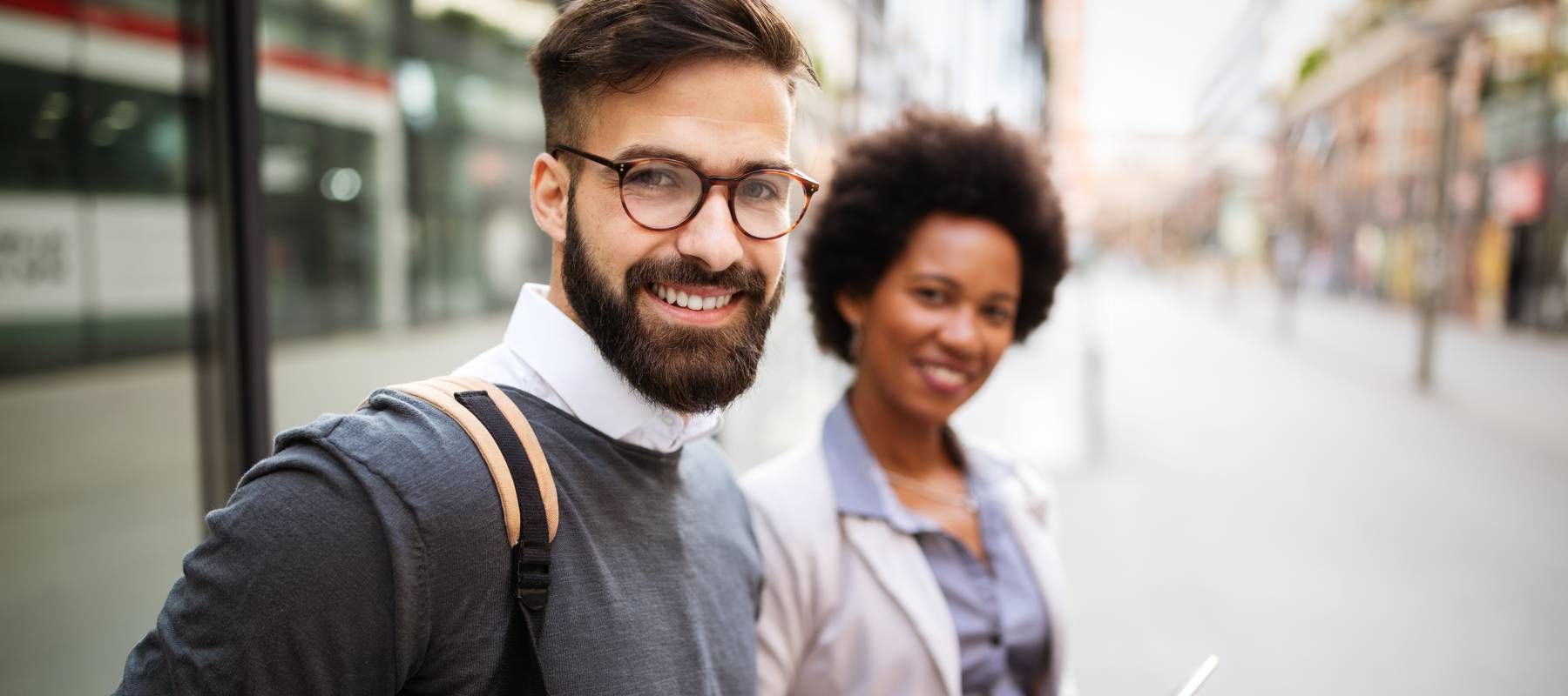 Caucasian man and Black woman talking outside company with holding coffee break time concept