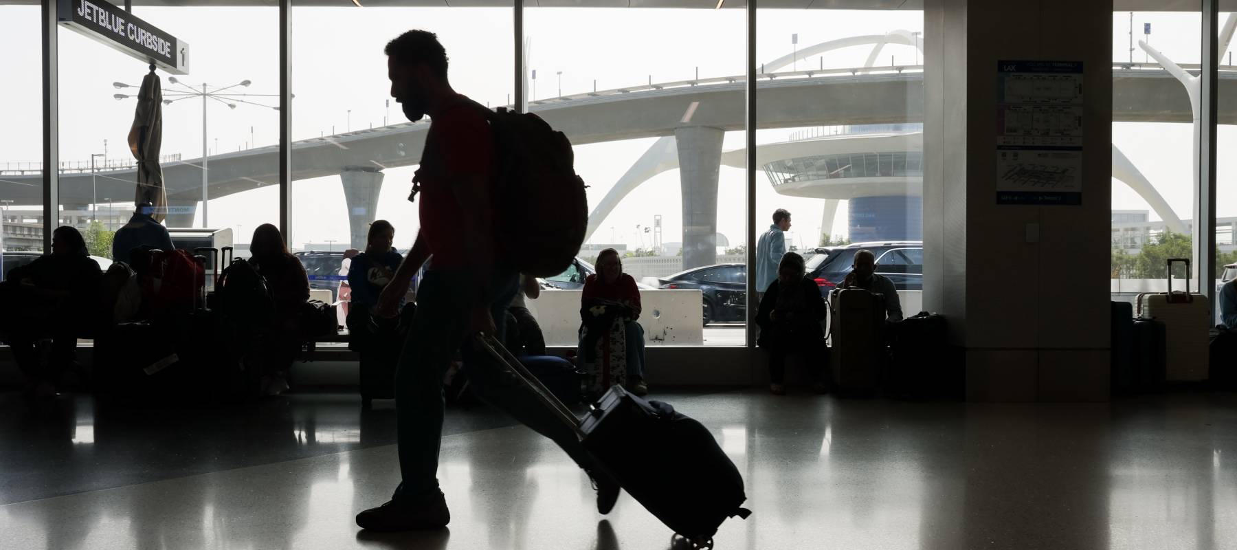 Travelers arrive at Los Angeles International Airport on Nov. 3, 2025.