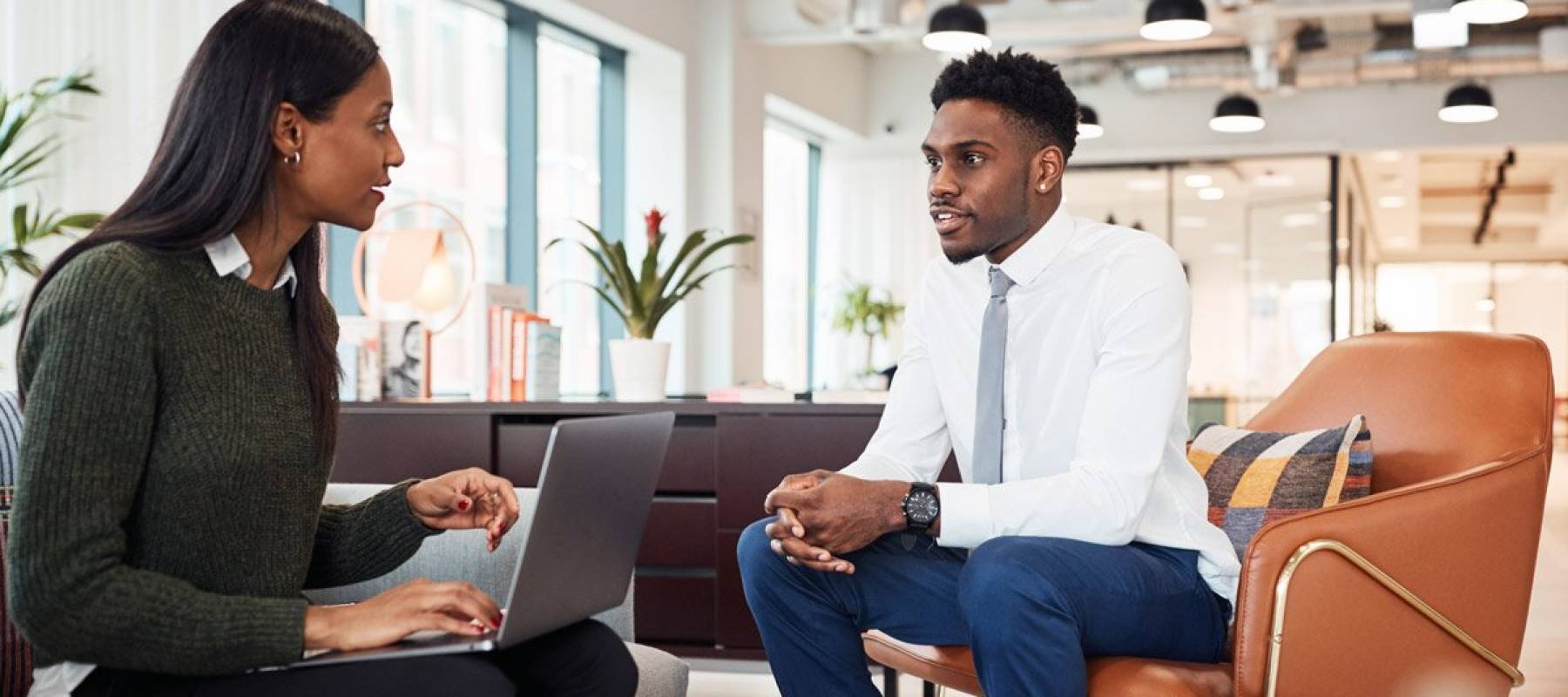 Female African-American hiring manager interviews African-American job candidate