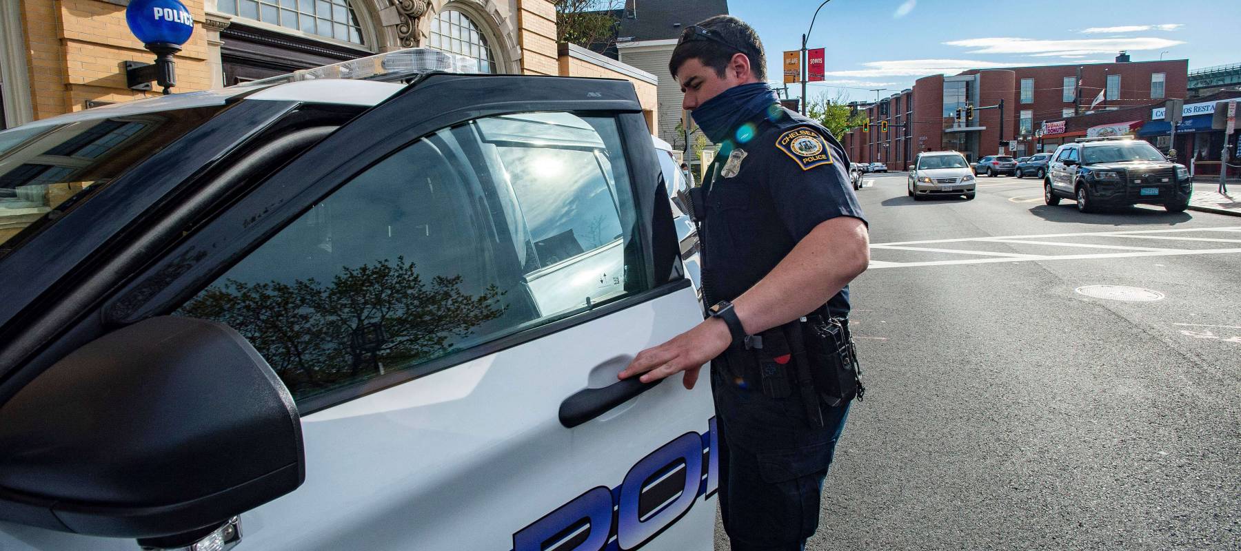 Officer going into his car in Massachusetts.