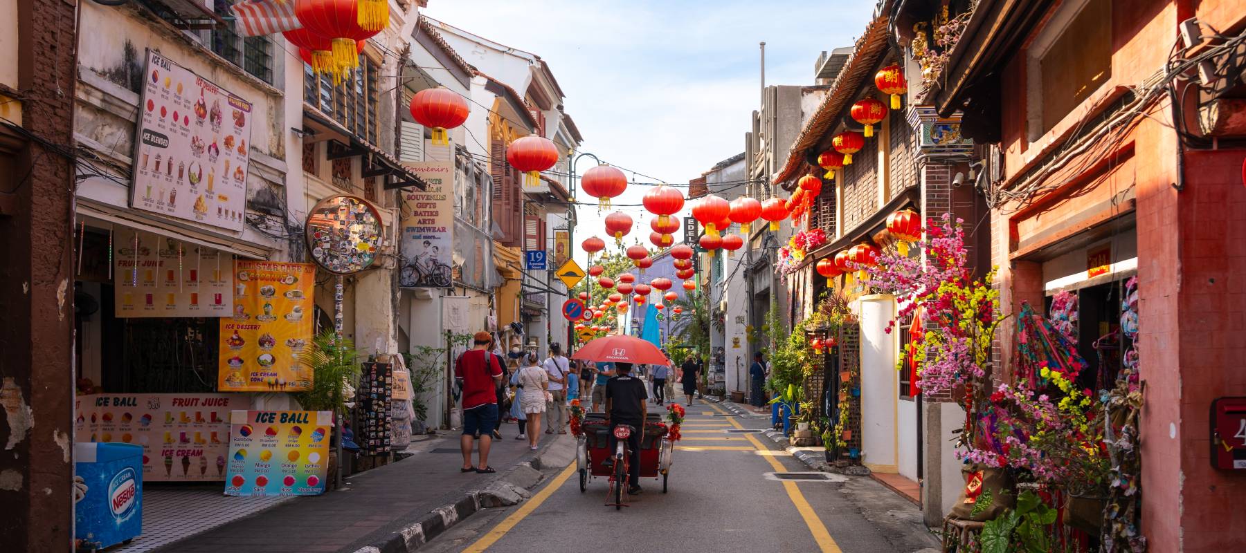 Shophouses line a narrow street in George Town, Malaysia.