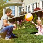 Happy smiling family with child over  house background