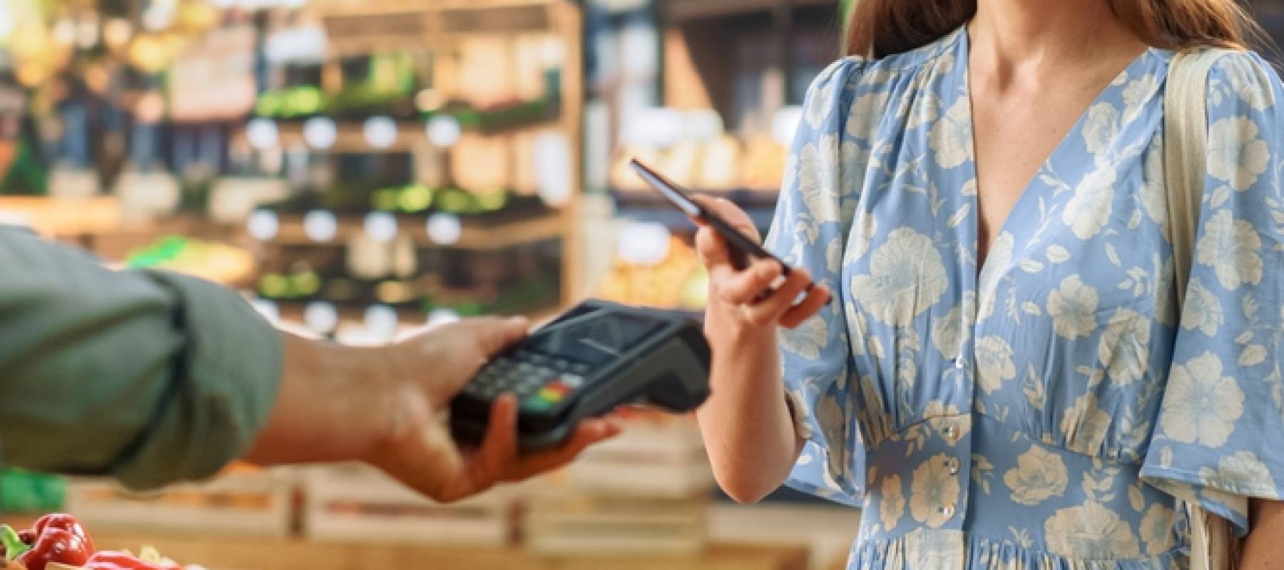 Stylish Young Woman Using Smartphone with Contactless NFC Payment Technology