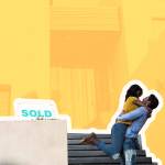 happy couple hugging in front of home with sold sign