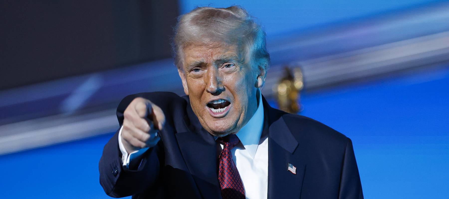 U.S. President Donald Trump gestures after delivering remarks during the America Business Forum at the Kaseya Center on November 05, 2025 in Miami, Florida.