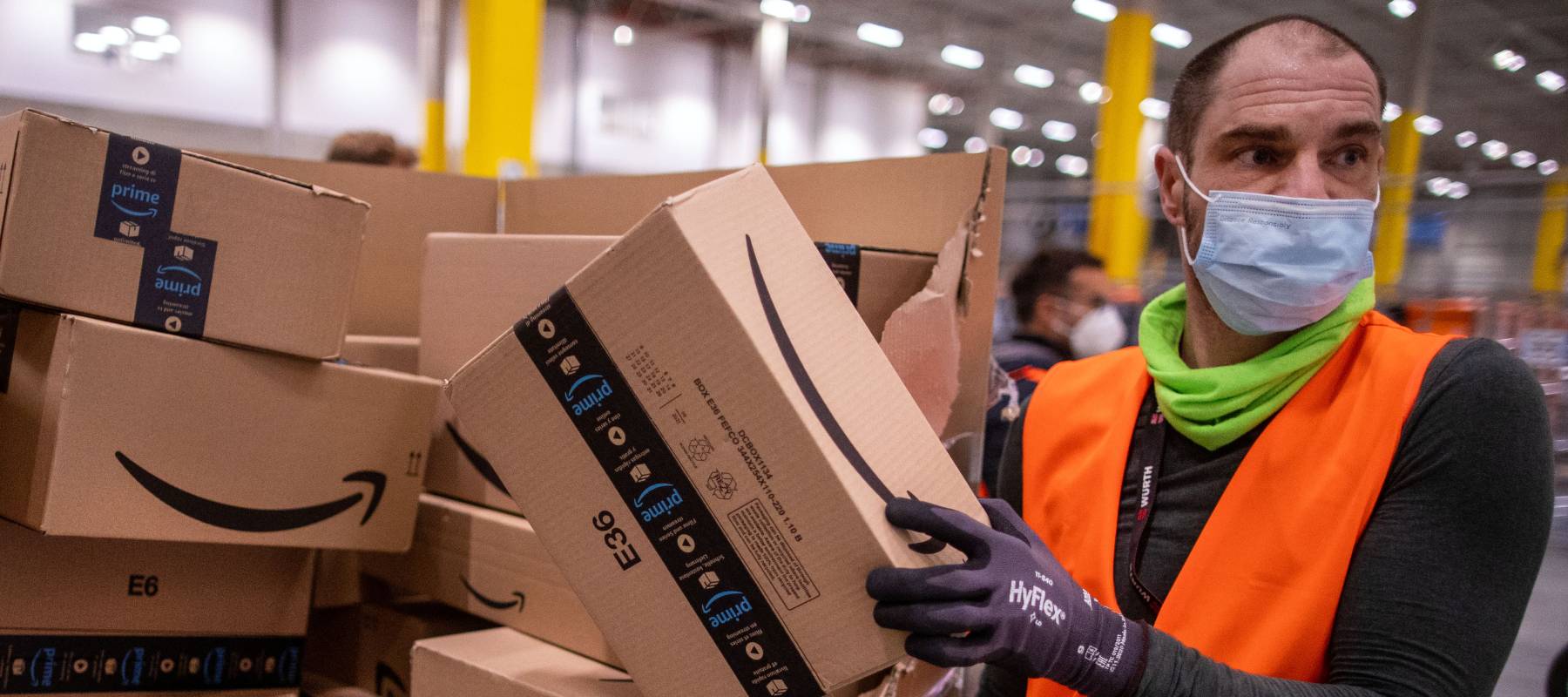An employee sorts parcels at an Amazon distribution center in Neubrandenburg, Germany, Oct. 13, 2021.