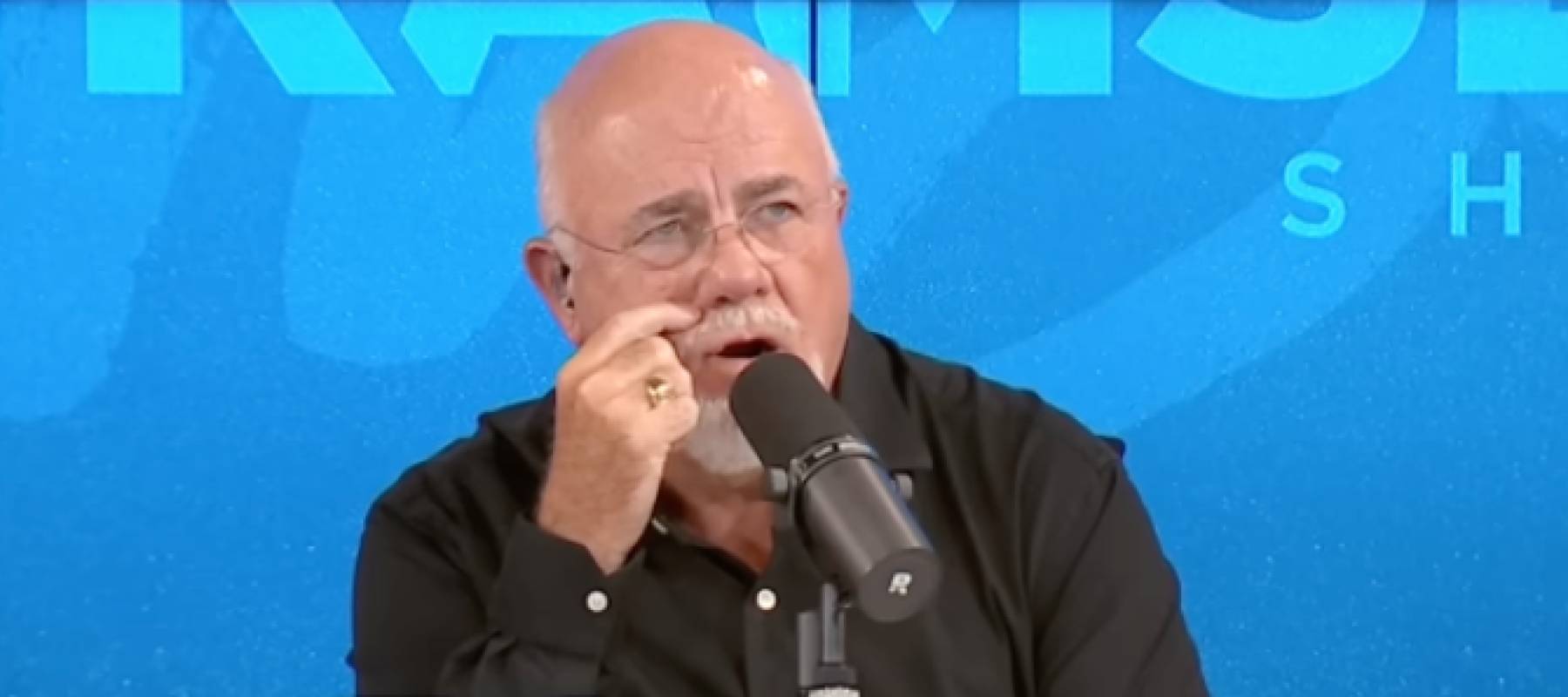 Dave Ramsey listening to a caller on The Ramsey Show.