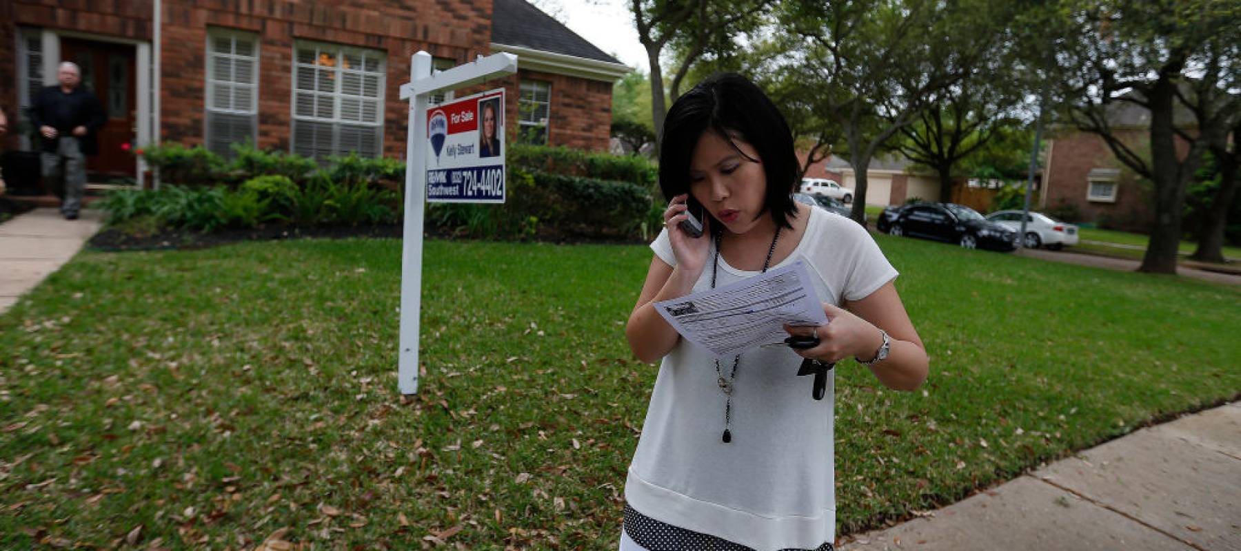 Realtor Julie Tam talks on the phone