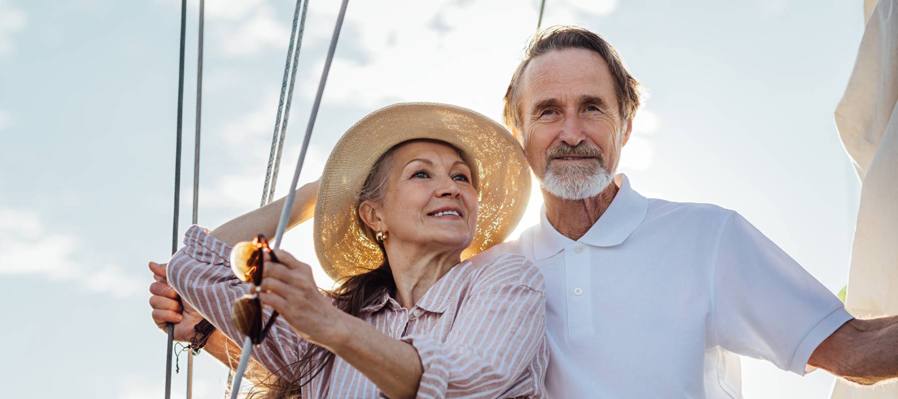 wealthy retired Caucasian couple on a yacht