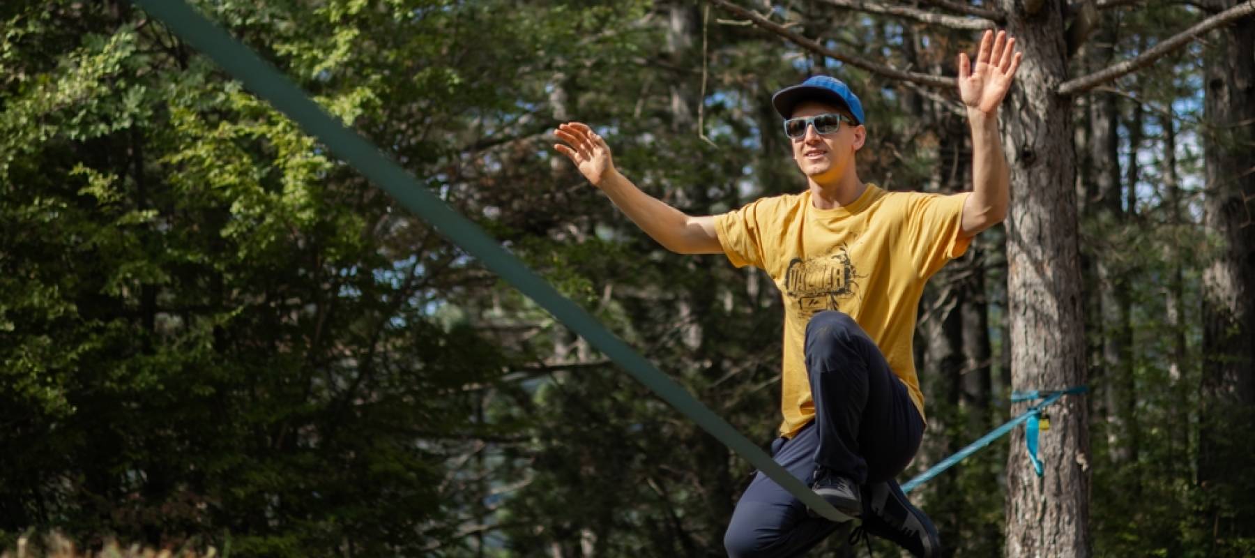 Young man in a crunch on a slackline