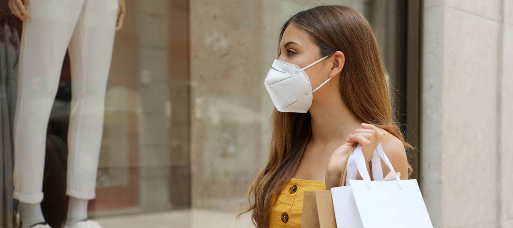 Woman in mask shopping