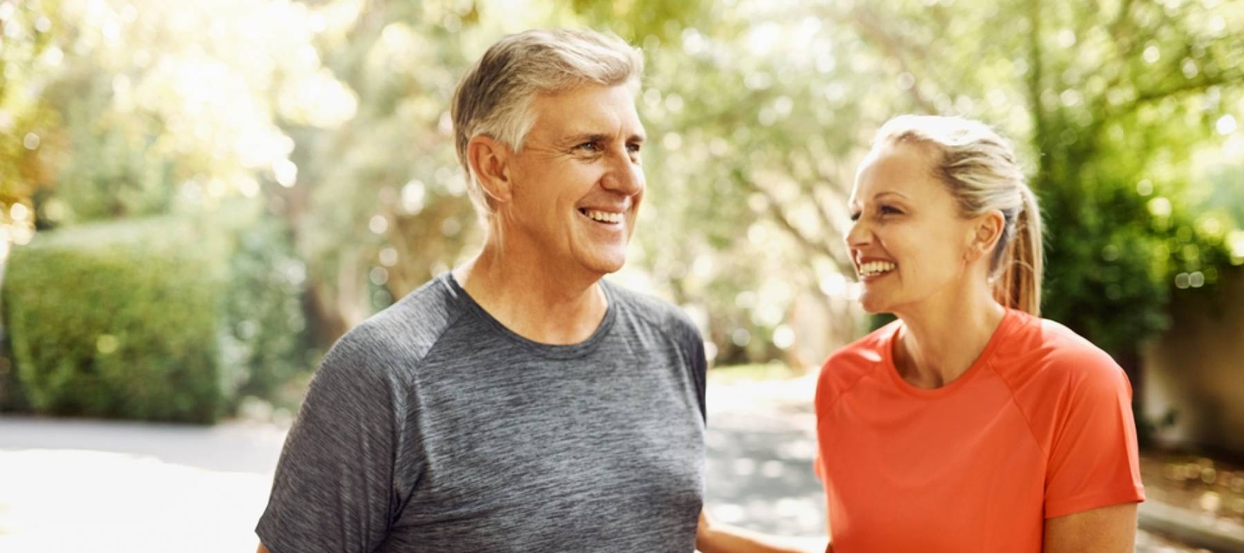 happy, mature Caucasian couple going for a walk