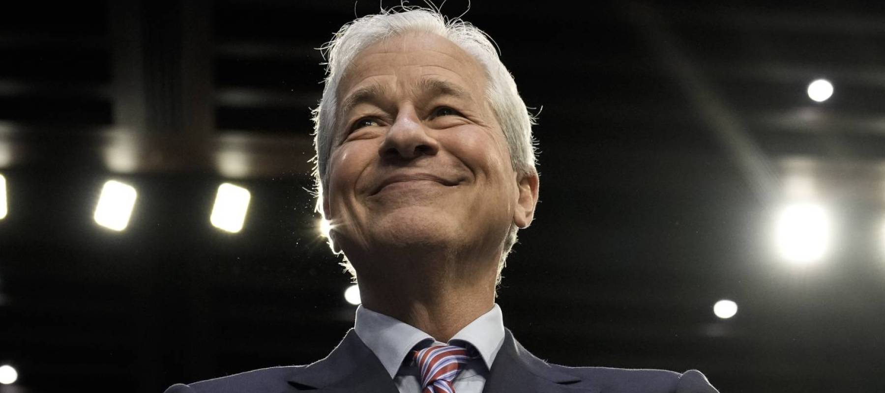 Jamie Dimon, CEO of JPMorgan Chase, smirks at the camera.