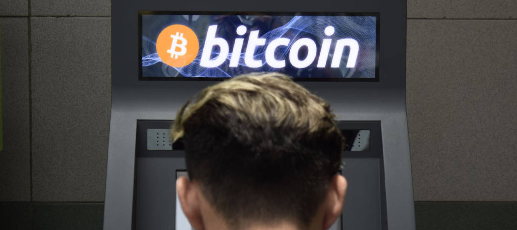 A bystander uses a Bitcoin ATM in San Salvador, El Salvador