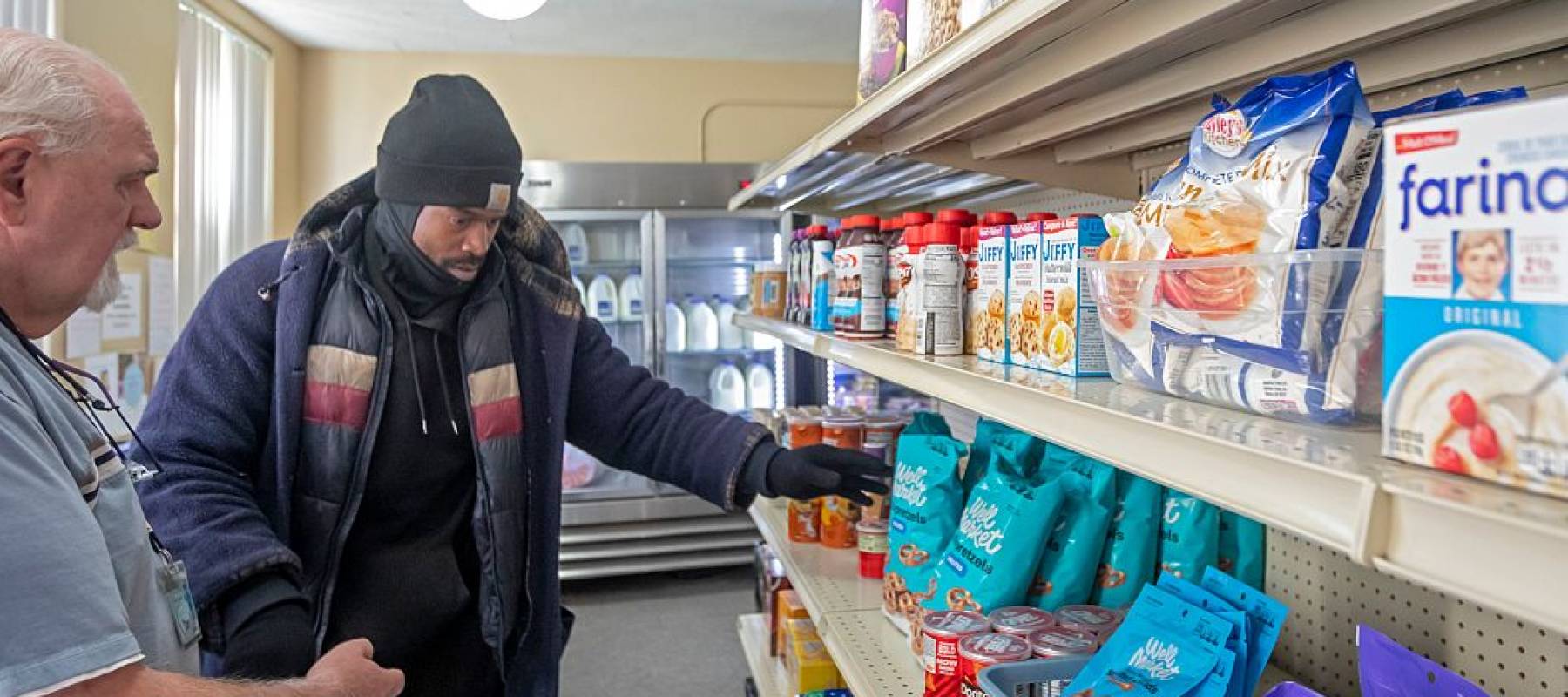 People pick up groceries at the nonprofit Deo Gratias Food Pantry