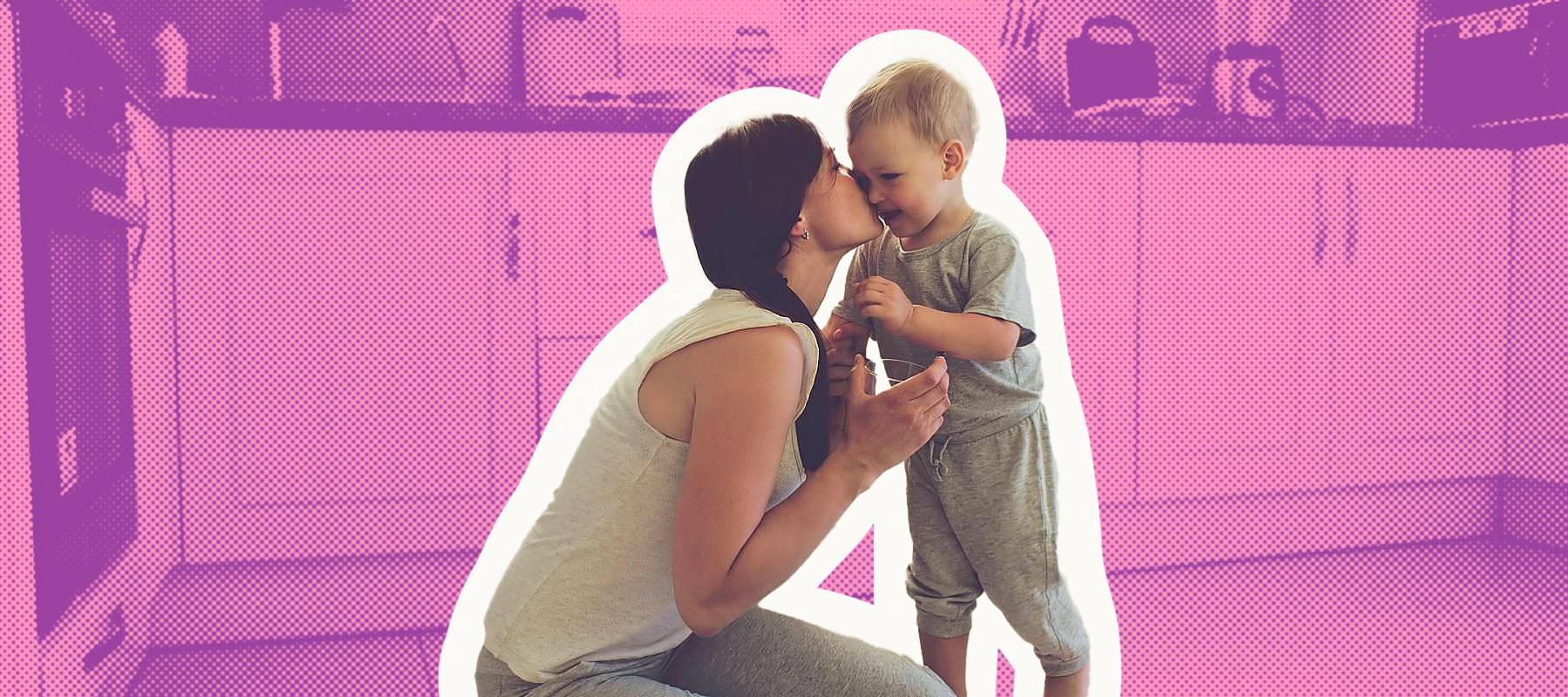 Mother with her 2 year old child cooking in the kitchen