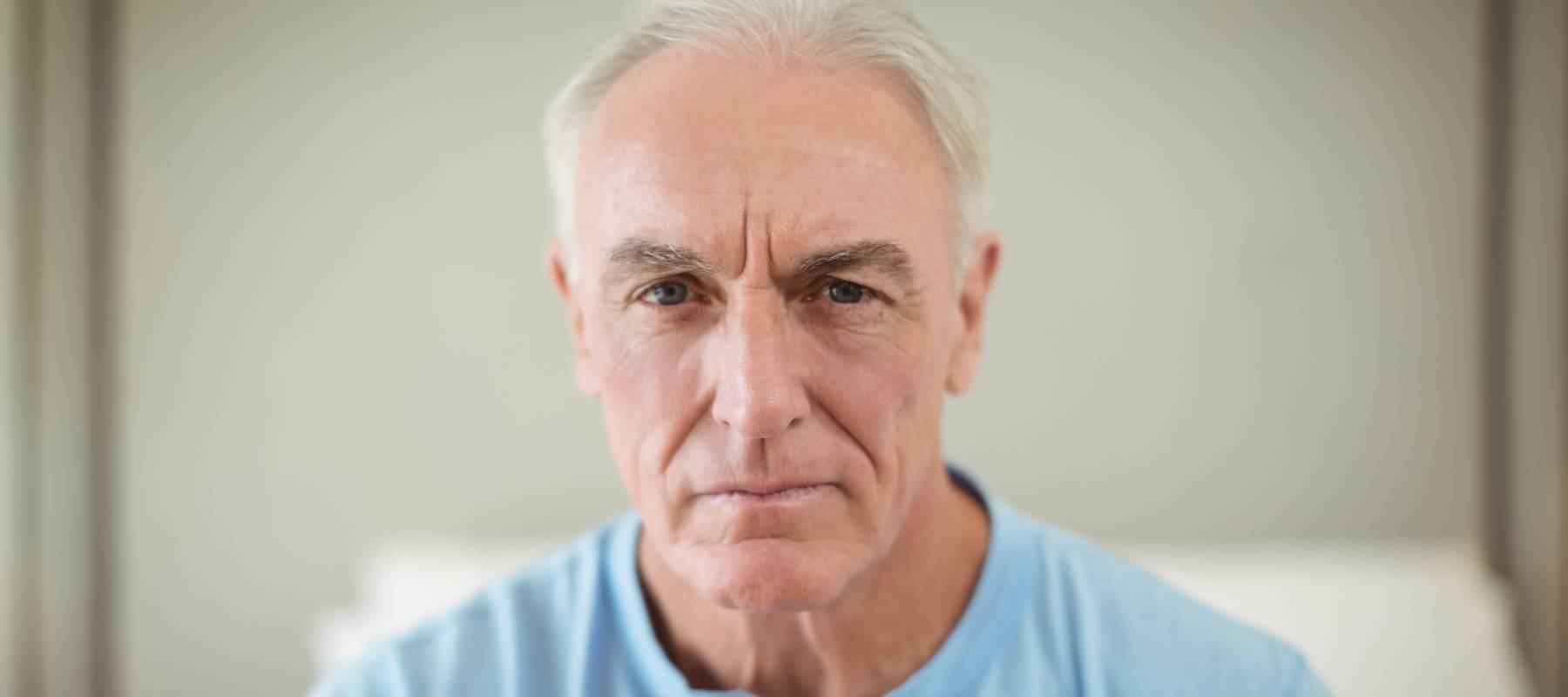 worried Caucasian senior man looking at camera
