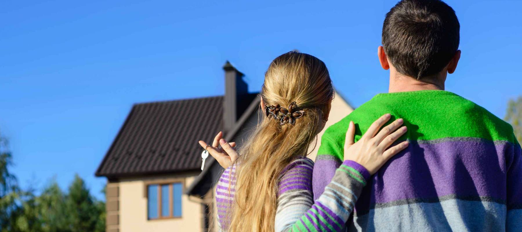 young couple near his house