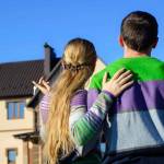 young couple near his house