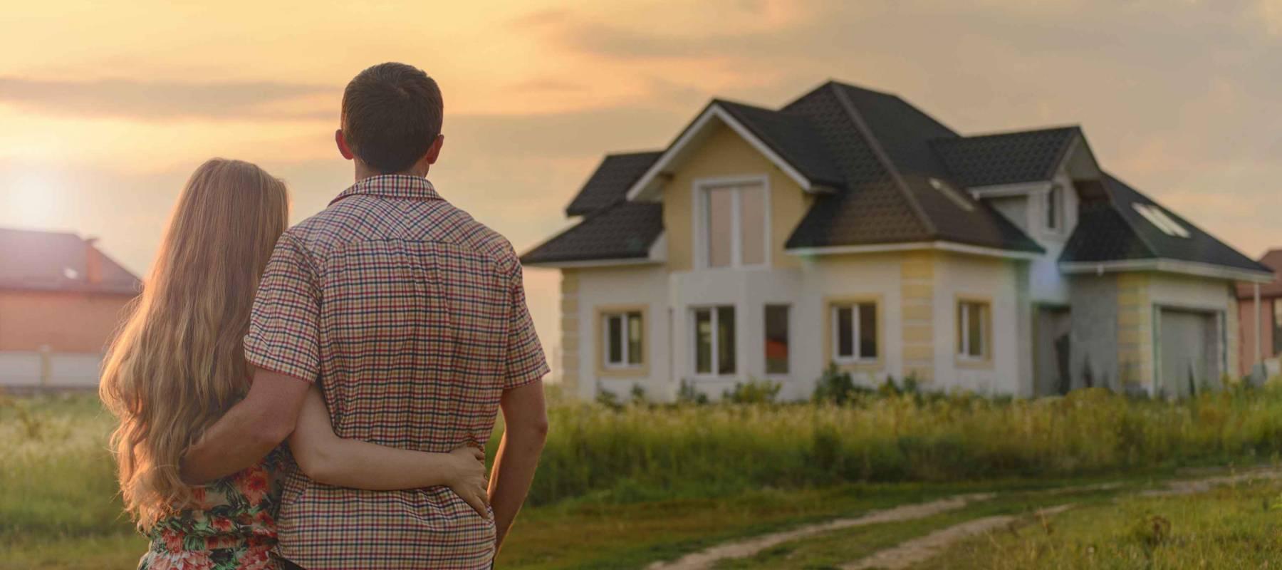 couple looking on house