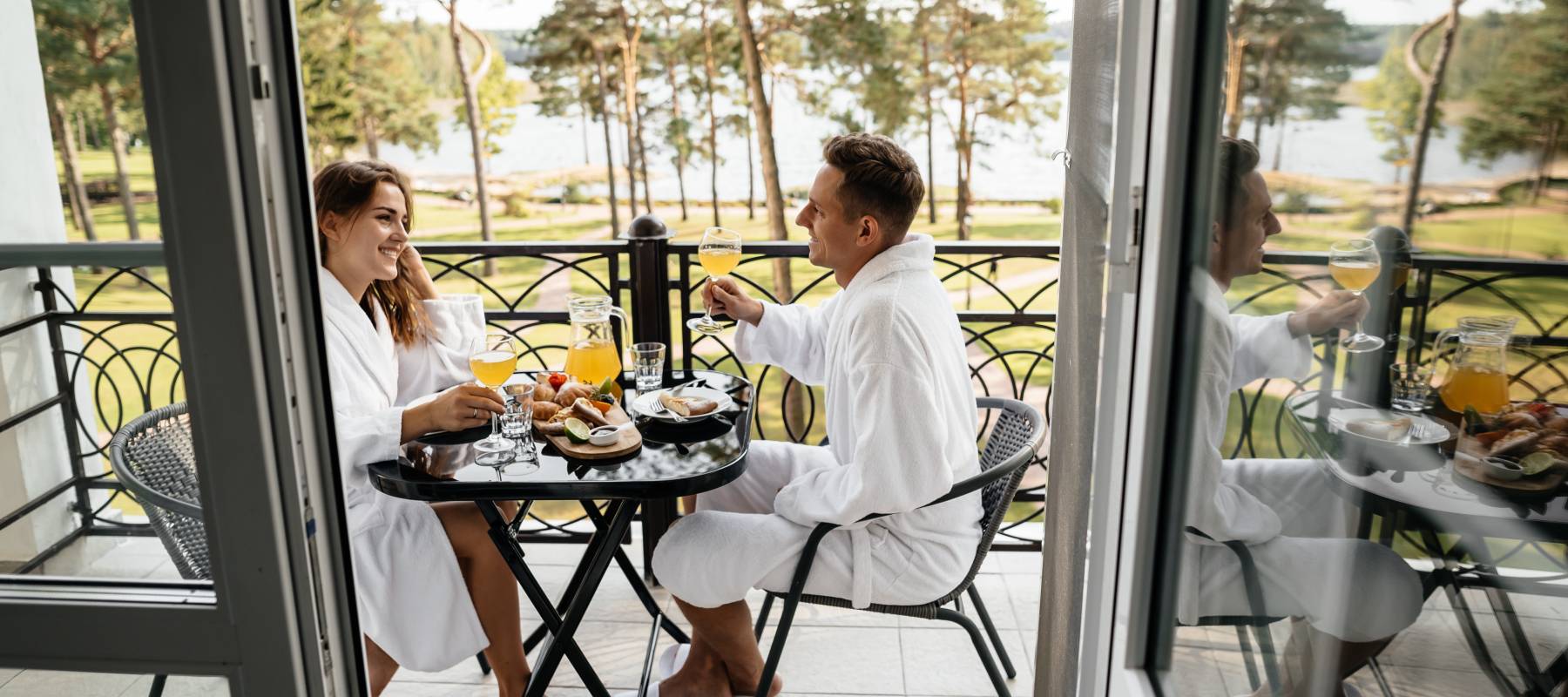 young Caucasian couple on balcony of a hotel while on vacation