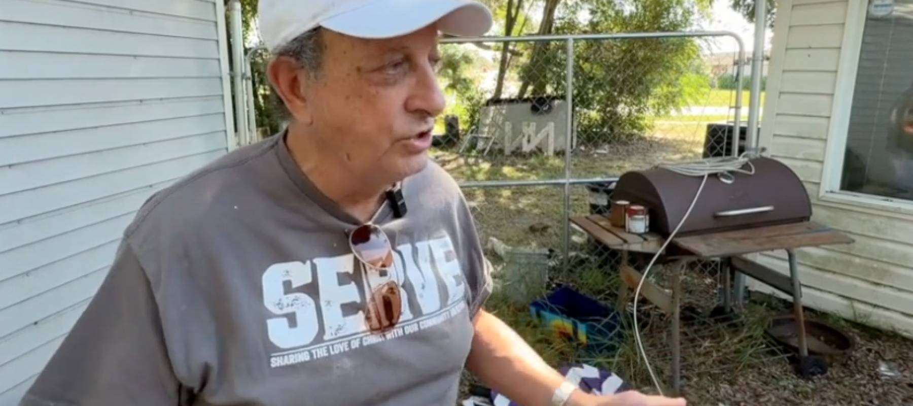Florida landlord Tom Luby speaking to reporters outside his rental home.