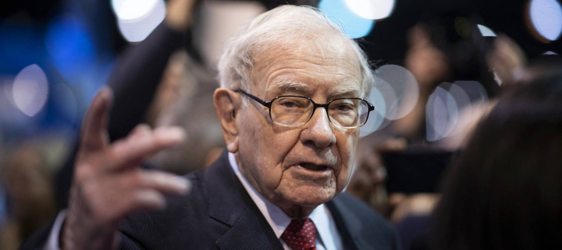 Warren Buffett looks blankly at the camera.