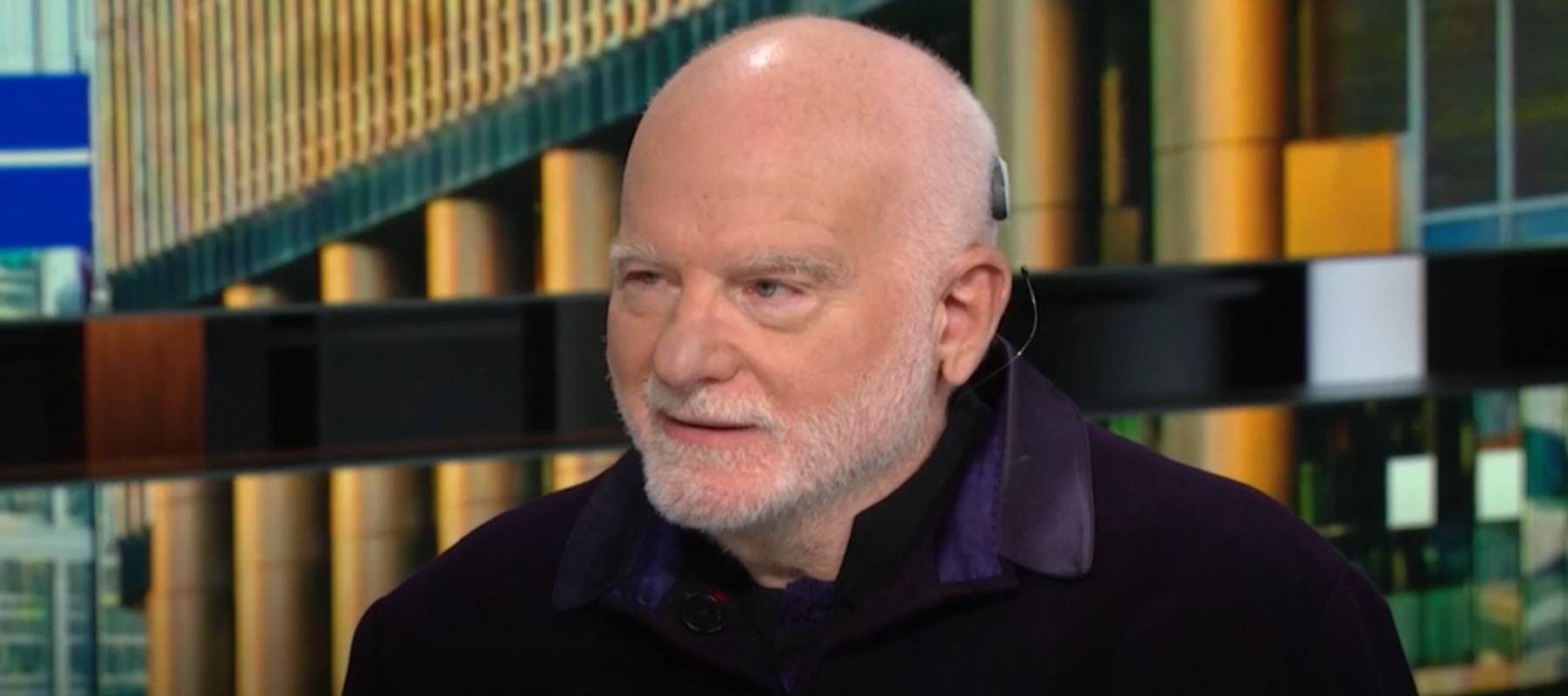 A young wealthy couple drink coffee together at a stylish bar.
