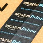 Amazon Prime logotype printed on cardboard box security scotch tape.