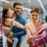 a young Caucasian family shopping for school supplies