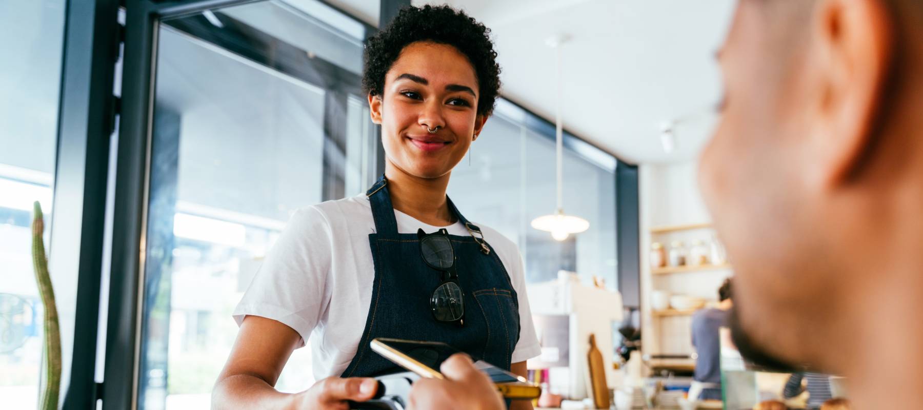 barista woman in a coffee shop