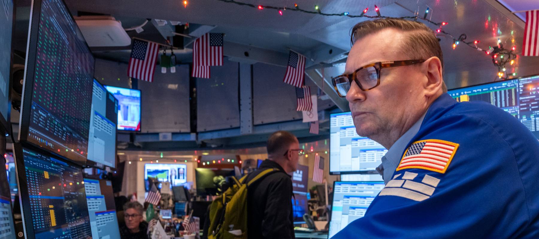 Traders work on the floor of the New York Stock Exchange (NYSE) on December 11, 2025, in New York City.