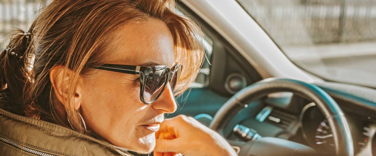 woman in the driver's seat of a car