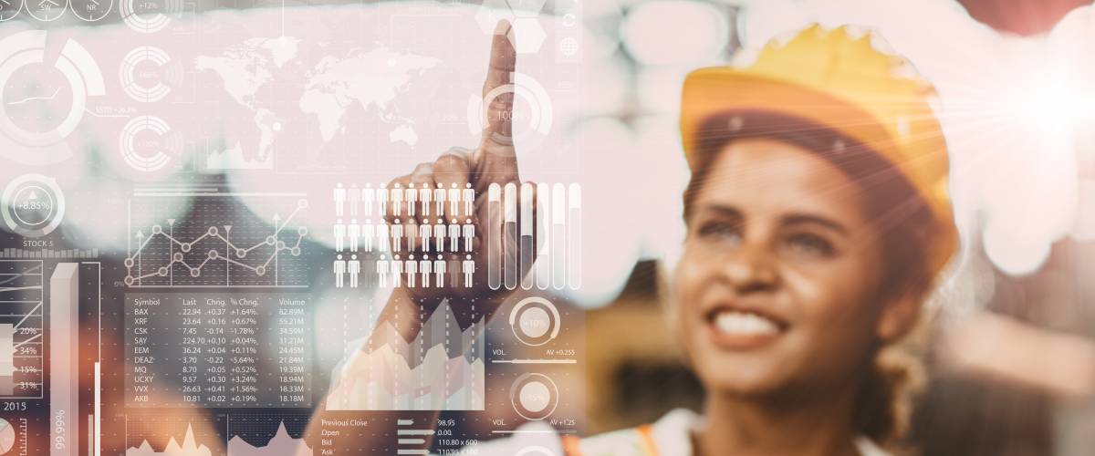 a woman in a hardhat looking at mathematical equations on a virtual screen