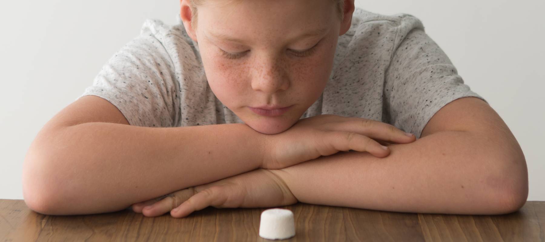 Kid staring at marshmallow