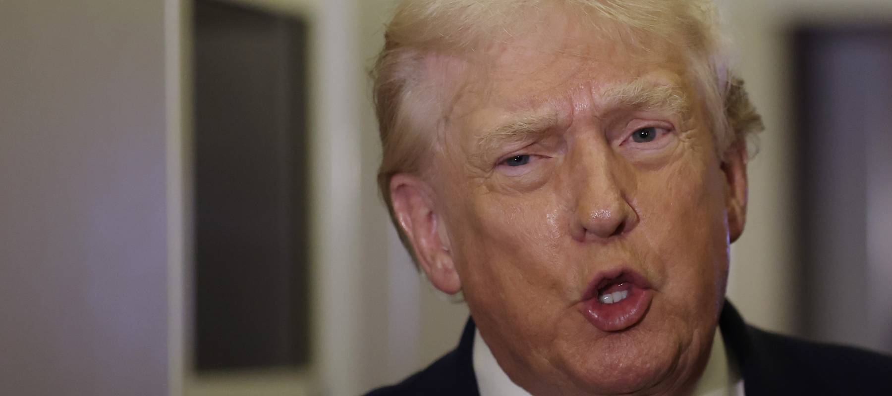 President Donald Trump speaks to the media aboard Air Force One en route to Washington, DC on January 04, 2026.