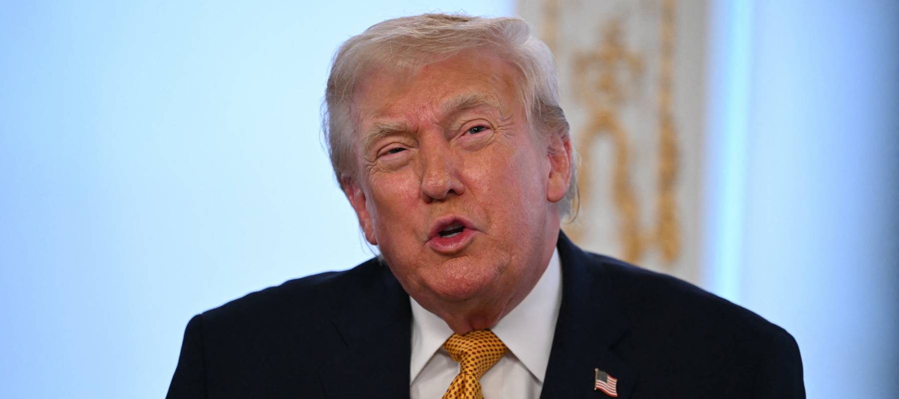 US President Donald Trump participates in calls to US service members, on Christmas Eve, from the Mar-a-Lago club in Palm Beach, Florida, December 24, 2025.