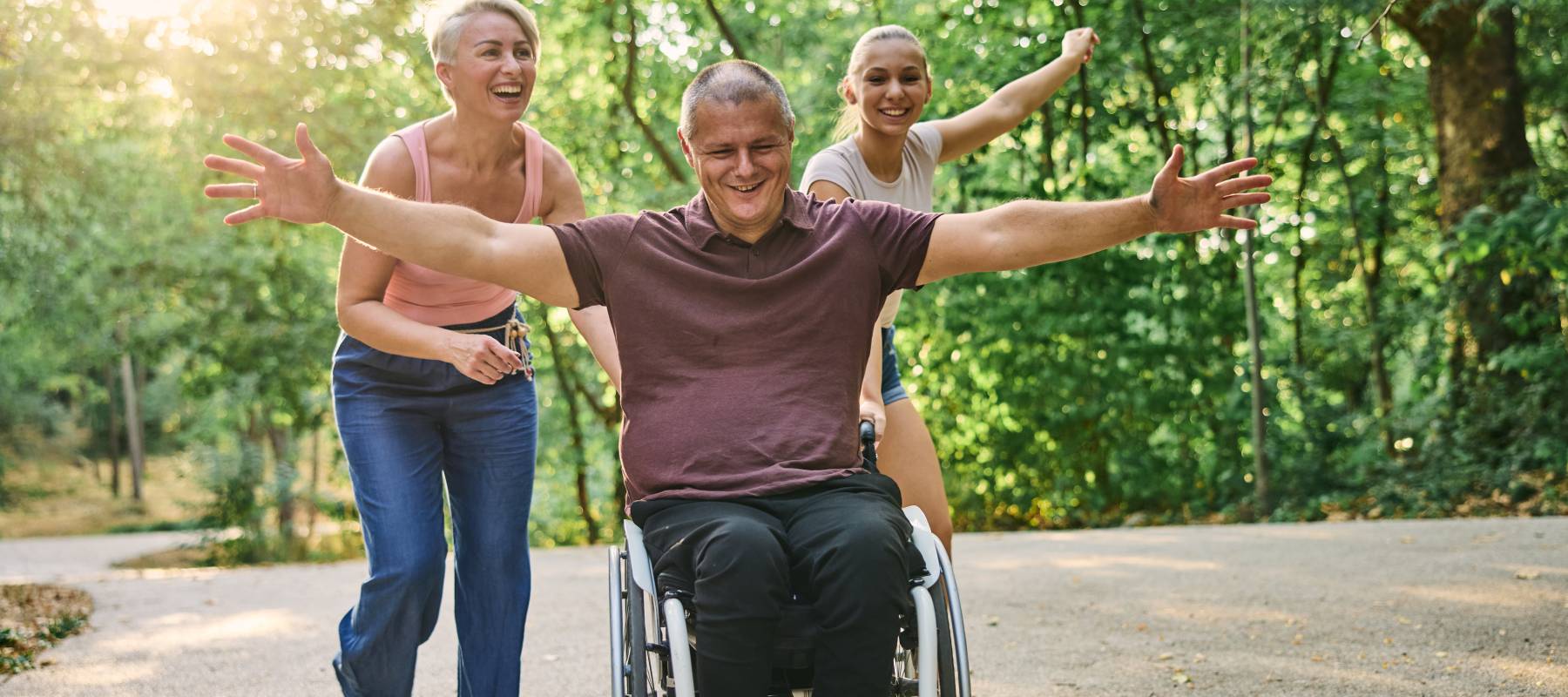 Family laughing in a park.