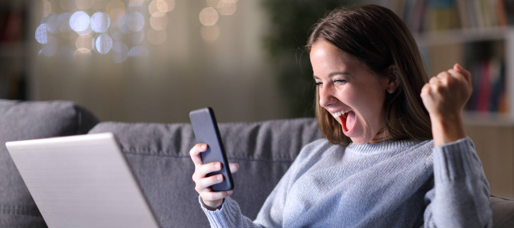 Woman excited about earning cash back